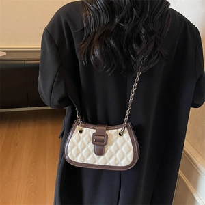 Vintage quilted crossbody bag in creamy white with brown trim and gold chain strap