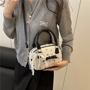 Mini cream bubble texture boston bag with black bow embroidery and leather handles