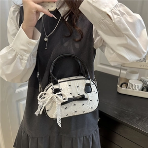 Minimalist black and white shoulder bag with bows and pearl lace charm in soft texture