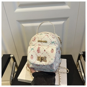 Detail of white mini backpack with cartoon prints, fashion logo and metal chain strap