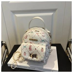 Detail of white quilted backpack with floral bear prints and gold FASHION metal plate
