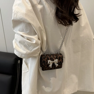 Chic leopard print mini bag with silver metal bow and chain strap for stylish women