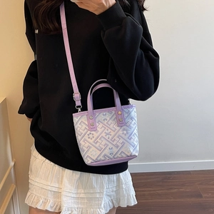 Compact purple and white bucket bag with floral embroidery and detachable strap
