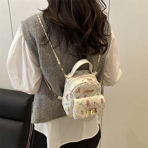 Mini white backpack with pink cartoon floral patterns and gold chain straps for women