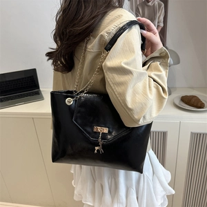Retro black faux leather tote bag with gold deer charm and chain strap for women