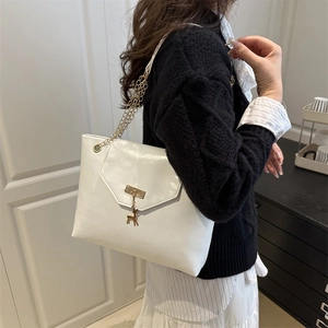 Chic white patent leather tote bag with golden deer pendant and chain shoulder strap
