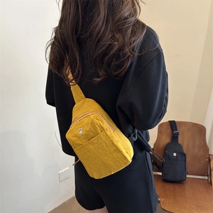 Fashionable yellow nylon crossbody chest bag for women with large capacity on model