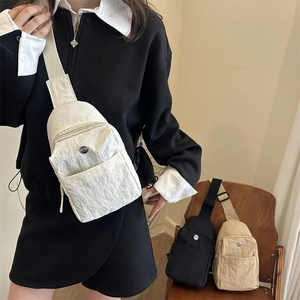 Women's pleated nylon chest bag with adjustable strap in black, white, and beige colors