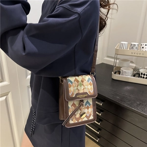 Chic woven rectangle crossbody bag with brown leather trim and golden metal pendant