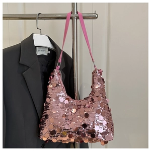 Detail of pink sequin hobo bag with reflective metallic disks and slim shoulder strap