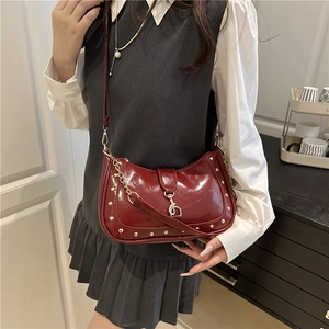 Retro dark red crescent shoulder bag with polished PU leather and gold rivet details