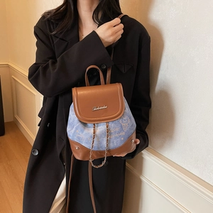 Mini brown leather and denim patchwork backpack with cat prints and chain details