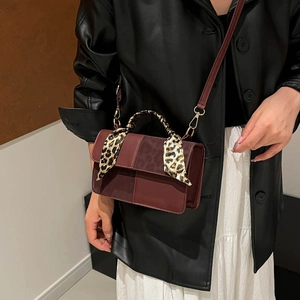 Fashionable color-block square handbag with leopard scarf handle and leather crossbody strap