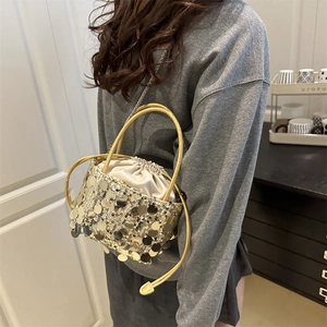 Fashionable gold sequin bucket bag for women with drawstring satin lining and handle
