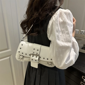 White rivet shoulder bag with silver studs and buckle in a chic biker baguette style