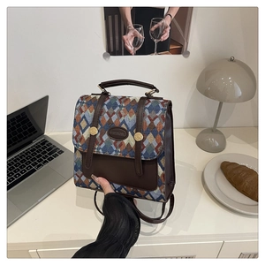 Close-up of retro geometric woven pattern backpack with premium leather details