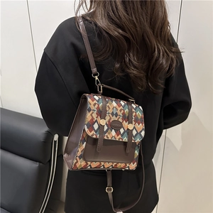 Retro geometric woven backpack with adjustable leather straps in an autumn color palette