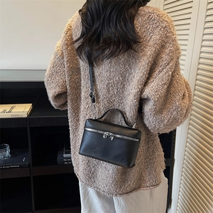 Chic black lychee leather vanity bag with heart-shaped zippers and crossbody strap