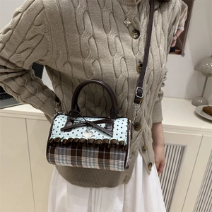 Sac à main cylindrique à carreaux avec nœud décoratif et bandoulière réglable