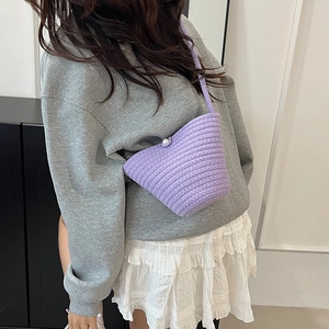 Purple handmade knit bucket bag with pearl detail and crossbody strap for women