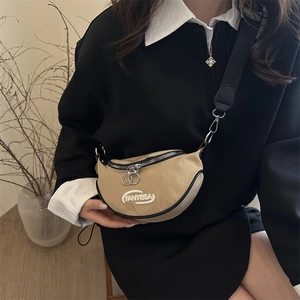 Chic khaki canvas crescent saddle bag with black wide strap and silver ring zipper