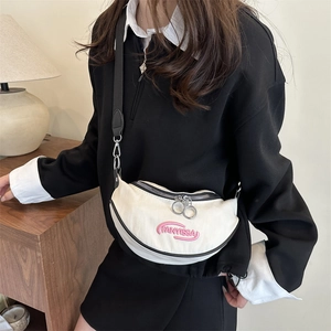 Chic beige crescent saddle bag with pink embroidery and adjustable strap for women