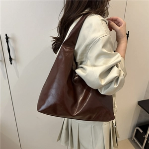 Minimalist large brown faux leather tote bag for women featuring a vintage oil wax finish