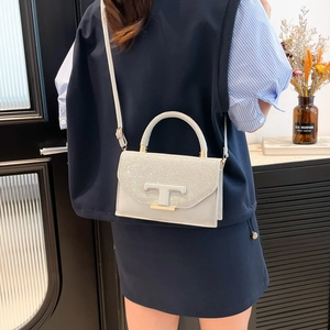 Minimalist light gray crossbody bag with sequin flap and metallic T decoration