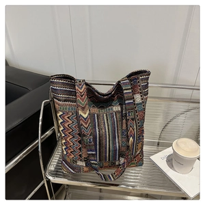 Detailed view of large ethnic canvas tote bag with vibrant geometric woven patterns