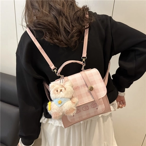 Pink checkered backpack for women with white bear charm and metal buckle hardware