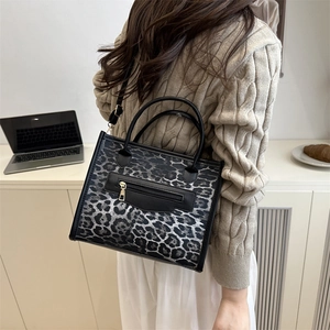 Women's leopard print crossbody bag with metallic zipper and adjustable strap