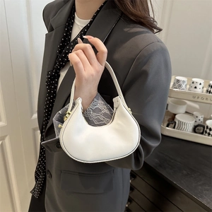 Minimalist white half-moon hobo handbag with elegant gold hardware for modern women