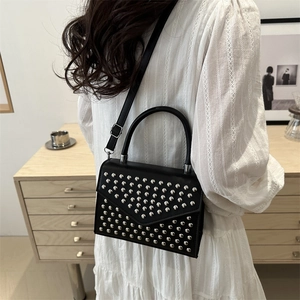 Fashionable black faux leather crossbody bag with silver rivet studs for women