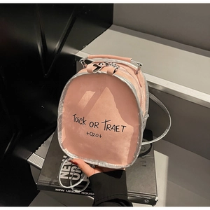 Pink PU leather backpack with silver trim and black Trick or Treat graphic