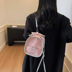 Pink glossy mini backpack with silver trim featuring Halloween themed graphic design