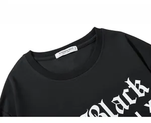 Close-up of ribbed crew neck and gothic Black print on black cotton sweatshirt