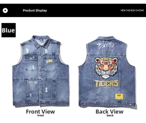 Détails de la broderie tigre au dos d'un gilet en jean bleu délavé vintage