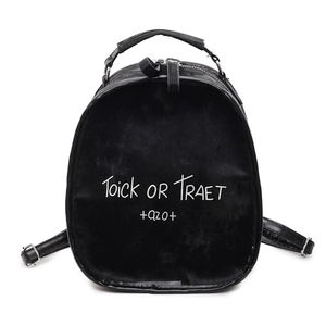 Minimalist black velvet mini backpack with Trick or Treat print and top handle for women
