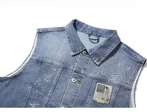 Close-up of blue washed denim vest featuring Bee Yourself embroidery and crown motifs