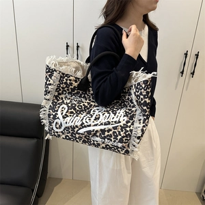 Leopard print canvas tote bag with white fringe trim and black handles for summer