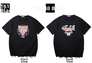 Front view of black cotton T-shirts with tiger and monkey graphic prints in a flat lay style