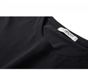 Detailed macro view of black cotton T-shirt neckline with 2XL size tag and clean stitching