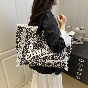 Chic leopard print canvas tote bag with white tassel edges and vintage lettering print