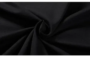 Macro shot of high-quality black knitted cotton fabric with a fine smooth texture
