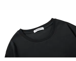 Detailed close-up of ribbed crewneck collar and 3XL brand label on black hoodie
