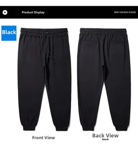 Detailed front and back view of black cotton joggers with drawstring and ribbed cuffs