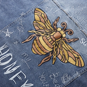 Denim jacket with vintage bee embroidery, honey queen script and gold crown details