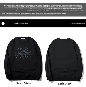 Flat lay view of black sweatshirt featuring iridescent Let Your Dreams Lead print details