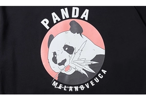Detail of cartoon panda print with pink circle and text on black cotton T-shirt