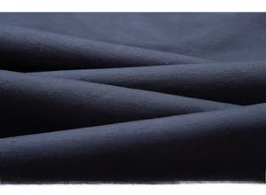 Detail view of high-density navy blue woven fabric texture with soft matte finish